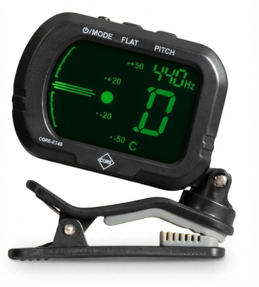 A black digital pitch and tone analyzer clip-on device with a green LCD display showing frequency and pitch information, mounted on a spring-loaded clip against a white background.